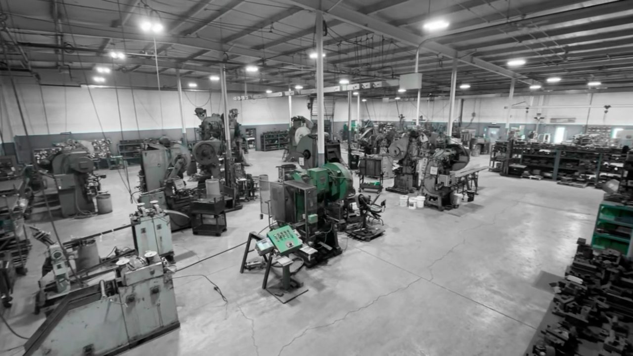 A large industrial workshop with multiple machines and workstations.